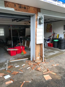 The author peeled back the siding and sheathing to find that the support framing had been placed directly on top of an untreated 4x6 timber that had rotted.
