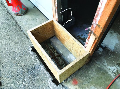 He epoxied rebar into the garage slab as well as the aprons.