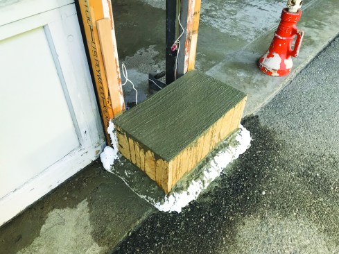 Then he poured the concrete footing.