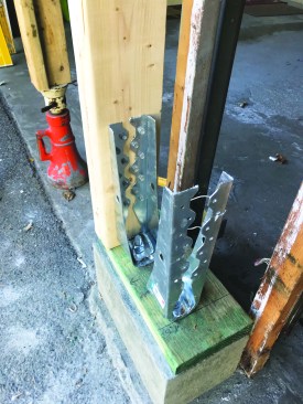 He drilled and epoxied galvanized holddowns into the concrete footing.