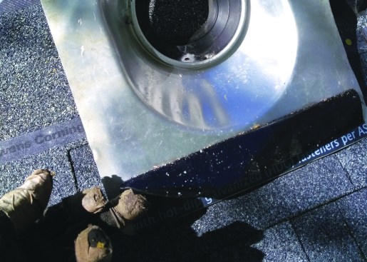 Apply flashing tape to the underside of the lower edge of the flashing, adhering half the strip to the metal.