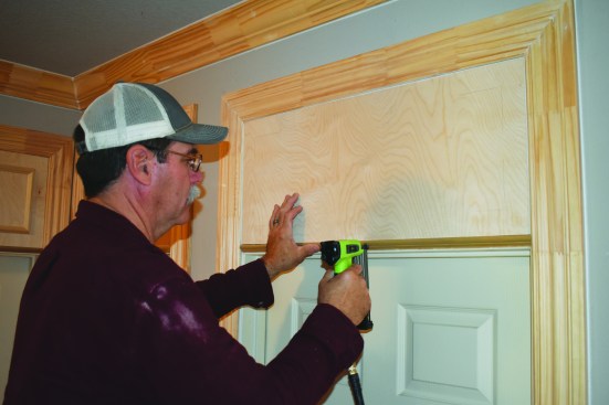 A molding strip goes between the door and the transom area.