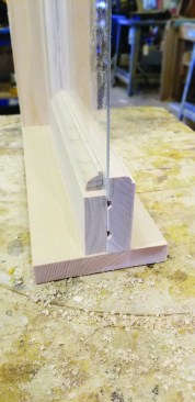 The second option looks more like a window sash in the transom.