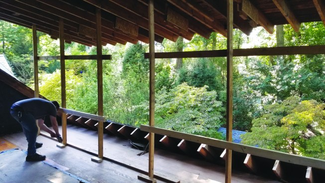 When the supports were plumb and in contact with the outermost stop, the roof was at the proper height.