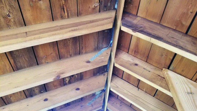 To allow the roof to hinge at the ridge, the crew attached metal twist straps to every other rafter.