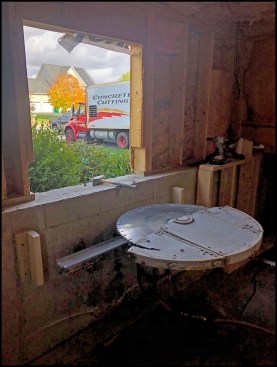 A typical occurrence at “grade floor openings” is that an existing window doesn’t meet minimum opening area requirements. Here, an existing double-hung window was removed and the opening enlarged.