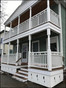 Located in a neighborhood where historic preservation requirements are linked to the local zoning permit process, the multifamily home’s two-story front porch was reconfigured to meet rise and run requirements for exterior stairs without encroaching on the city sidewalk.