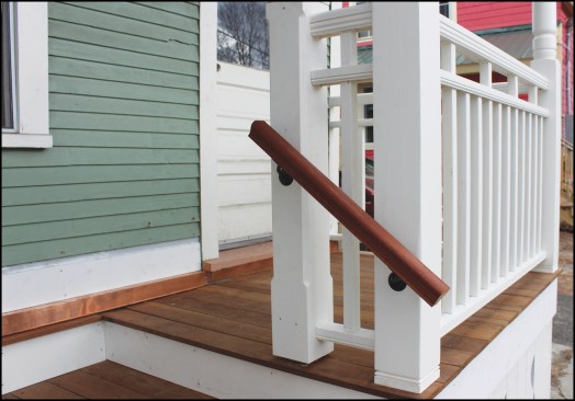 Post sleeves were fabricated from 1x6 stock using glued T&G box joints, which didn’t require fasteners that would interfere with cutting the corner chamfers. The stepped-out ledger was covered with a custom-fabricated copper flashing.