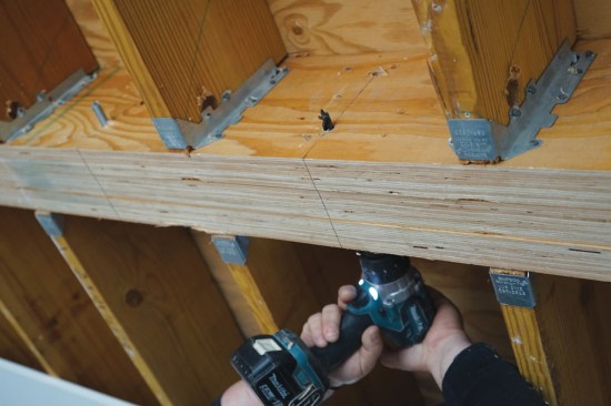 Repair work began with drilling for 1/2-inch threaded rod on 16-inch centers.