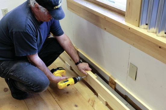 A glued butt joint joins the lengths of face board. Screws attach the end of the board to a backer block.