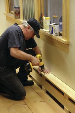 The top board screws to the top blocks and to the T-brackets while maintaining the proper overhang.