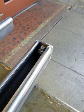 I welded a small steel plate and a 1/2-inch nut to the bottom of each post for attachment.