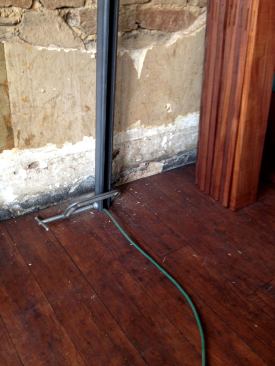 I slipped each post through a finished hole and held it at the proper height using a C-clamp.