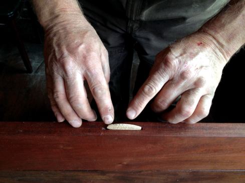 I cut a slot in the center of each board with a biscuit joiner and used a single biscuit to keep the boards aligned with one another. I dry-fit the biscuits without glue so that the boards could be removed and replaced easily in the event of damage.