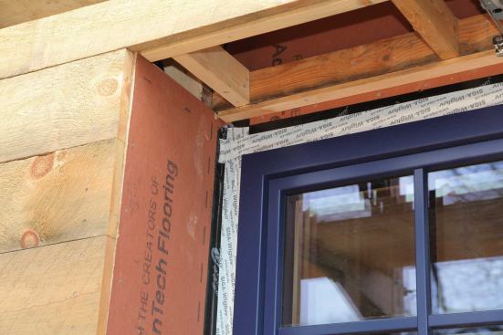 This photo was taken on a jobsite in Denver, four to six weeks after installers had done their work, and the flashing is already failing. Incompatible with the vinyl window fin and the sealant, the rubberized asphalt flashing is pulling away rom the window.
