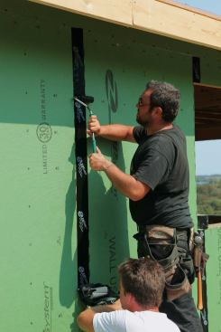 Although some installers use hand pressure to seat the flashing to the substrate, most flashings need to be rolled using a J-roller for proper adhesion.