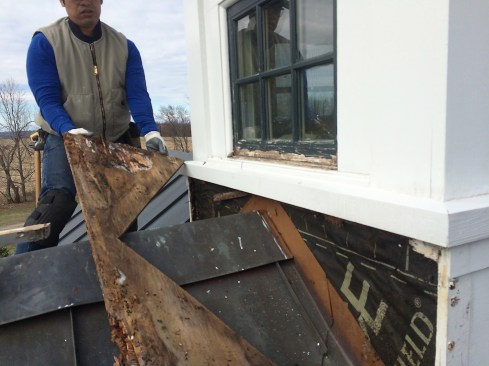 We began our investigation by removing the outer, plywood-clad finish base of the cupola. We found the copper roof-to-wall flashing had been reverse-flashed, with the copper placed on the outer surface of peel-and-stick.