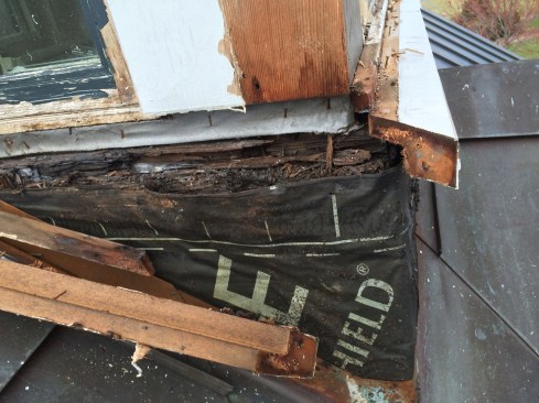 When we removed the existing corner boards and wrap-around sill, we discovered the previous builder omitted critical, transitional flashing between the cupola’s upper portion and its wider base.