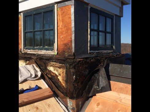 The Fix. Our plan was to rebuild the cupola’s base in place, salvaging as much of the existing structure as possible. Starting where the damage was the worst, we carefully removed the deteriorated material a little at a time to keep the cupola stable.