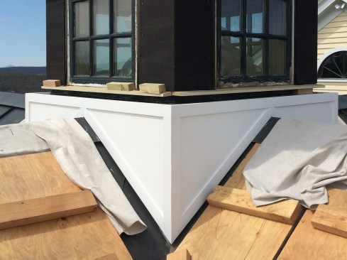 For the cupola base’s cladding, we cut the triangular shapes out of a 5/8-inch 4x8 sheet of PVC by Koma, fastened them with screws at trim locations, and glued trim pieces on top to hide the fasteners. 