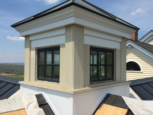 The through-sill solved the problem with the leaky seam between the existing factory-applied sill and trim; the window sash’s weatherstripping now sits on top of a solid piece of Boral. For the wall trim and corner boards, we used 5/4 Boral to match the existing salvaged cedar stock. 