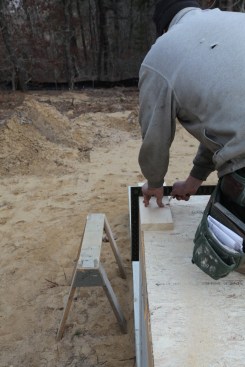 Using the same technique, the other side of the corner is marked. This process is repeated at the opposite end of the longest wall of the house to establish the corners of the baseline.