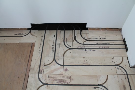 Smaller areas such as this bathroom can get complicated. To avoid confusion, the author labels the direction of all the tubing on the floor.