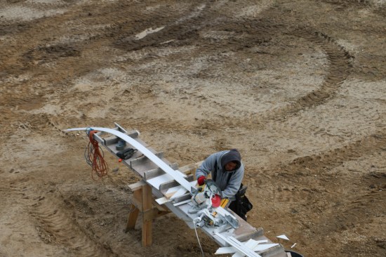 Because the PVC crown stock is so floppy, the crew cuts it on the flat, using the detents on a chop saw.