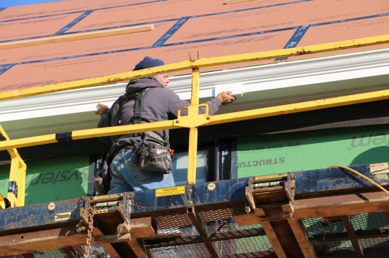 The gauge block is used again, this time to ensure that the fascia reveal is even all the way around the house.