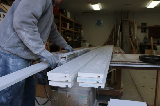 The crew prepares fascia stock by first ripping 1x10s to the proper widths in the shop. They cut a dado 1/2 inch from what will be the bottom of the fascia.