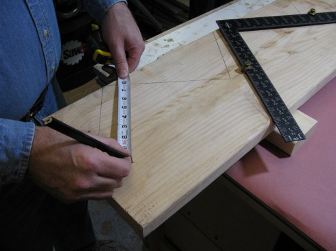 Measure down and mark the rise distance for the bottom of the first step.