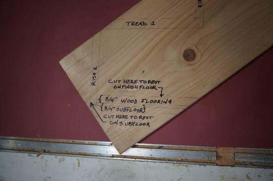 Draw in the bottom tread stock and measure down the unit rise to the top of the finished floor. Careful labeling will help clear up any confusion when you are cutting the stringer.