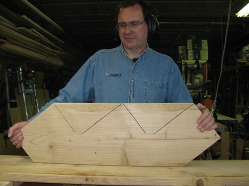 Flipping the stringer on edge shows where the circular saw cuts ended. Use a handsaw or jigsaw to finish the cuts.