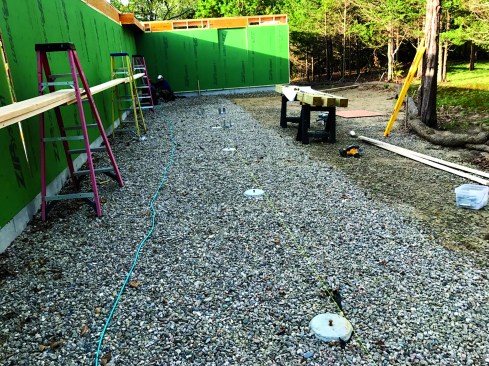 Crushed stone filled the area under the porch up to the tops of the footings.