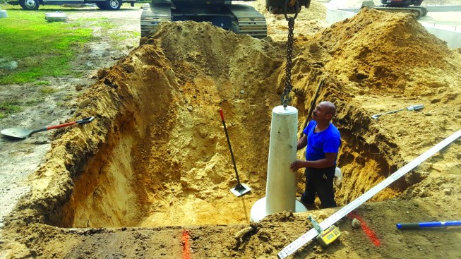 Each footing has an integral fitting for an eyebolt that was used to lift and place the footing. After the footings were placed, the crew used the fittings to attach the post connectors.