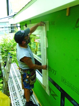 The author flashes the flange on the sides and top, with all the lengths done in two pieces. The side pieces extend past the top of the window.