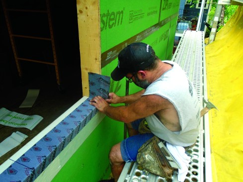 Flexible flashing tape creates a one-piece sill pan that seals the bottom of the opening from moisture.