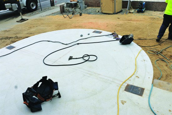 After laying out the curved beam directly on the first-floor slab, the author drew a full-size pattern on lauan plywood to help guide the metal fabrications