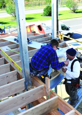Perpendicular blocking supports the outer edges of the plywood rim joist.