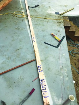 The author also made a story pole to record the heights of the two radiused beams, as well as the differences in the column heights due to the drainage slope of the slab.
