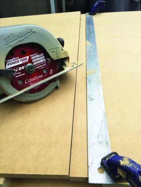 The author cut the toy-box parts from a sheet of 3/4-inch MDF, using an aluminum straightedge to guide the saw cuts.