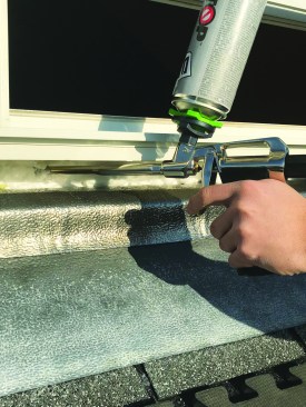While the window opening had been properly flashed and waterproofed at the time of the replacement window installation, the author air-seals the opening by applying low-expanding foam before installing the sill.