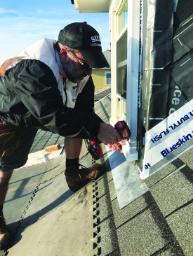 To lock the new sill in place, he drives galvanized screws from the edges of the casing and into the horns of the sill.