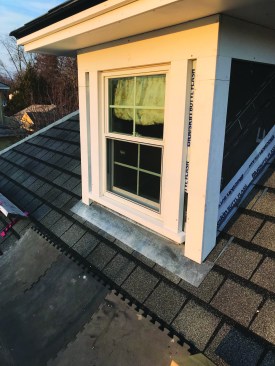 The screw heads will be hidden by the siding. With the corner boards installed, this dormer is trimmed and ready for siding.