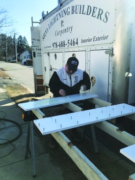 He applies PVC cement to both mating surfaces.