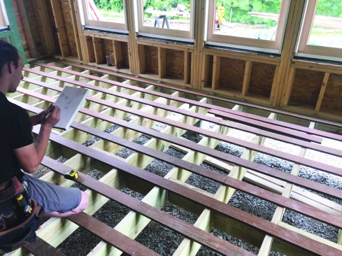 Once the crew has tacked every third row in place, one person makes a cut list for the infill boards.