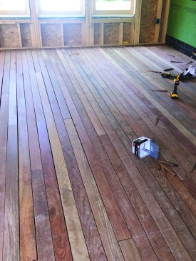 The crew cuts the infill boards and racks them between the tacked boards.
