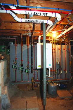 The exhaust flue for a condensing boiler doesn’t need to be masonry or metal; it can be made from ABS, PVC, or CPVC pipe with a high-temperature rating.