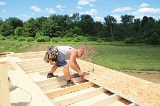With the layout marked on the sheathing, stud spacing can be tweaked to keep the studs straight.