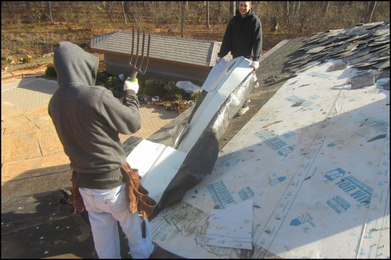 Here, a 5:12-slope synthetic slate roof that had been inappropriately installed over regular roof underlayment needed to be torn off (the manufacturer’s instructions called for full-coverage ice barrier membrane underlayment for slopes under 6:12).